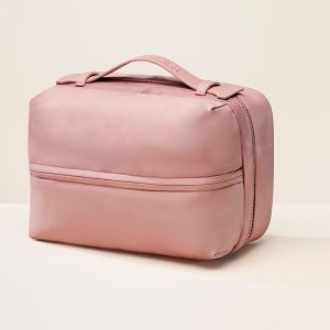 pdp puffy toiletry bag mauve handle.jpg